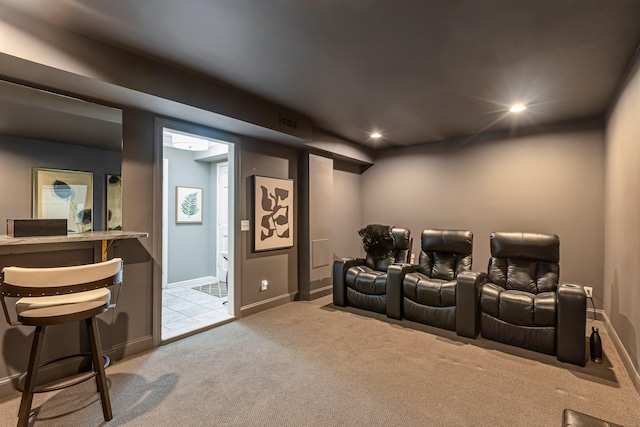 cinema room featuring baseboards, recessed lighting, and light colored carpet