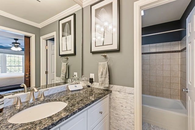 ensuite bathroom featuring ensuite bath, ornamental molding, ceiling fan, shower / tub combination, and vanity