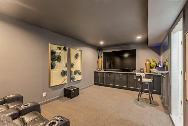 home theater featuring recessed lighting, light colored carpet, and baseboards