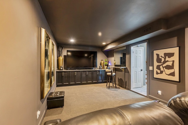 cinema room with recessed lighting, visible vents, light carpet, and baseboards