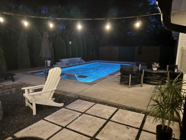 3715 Ivanora Dr, Spring Hill, TN 37174 - pool at twilight featuring a patio and an outdoor pool