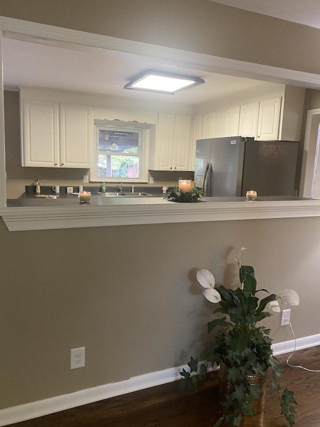 1015 S Baird Ln, Murfreesboro, TN 37130 - kitchen with stainless steel refrigerator with ice dispenser, white cabinetry, baseboards, a sink, and dark wood-style floors