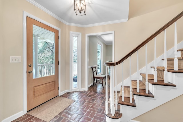 entrance foyer featuring stairway, brick floor, and baseboards