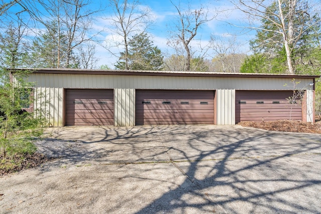 detached garage with aphalt driveway