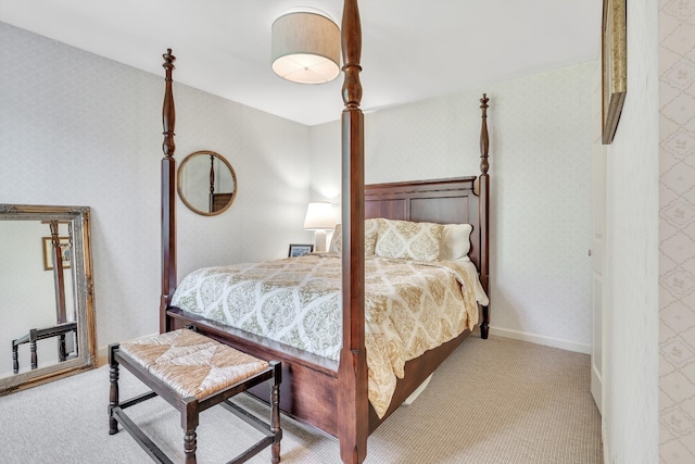 bedroom with wallpapered walls and carpet