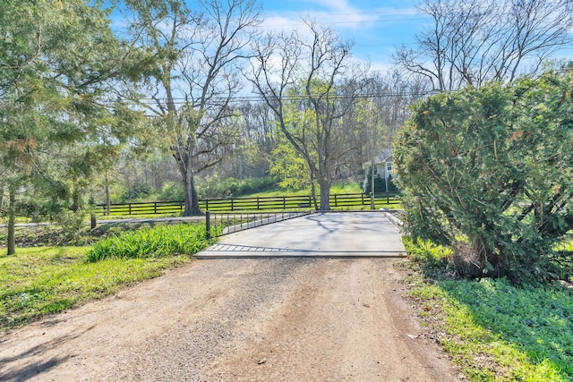 view of gate featuring fence