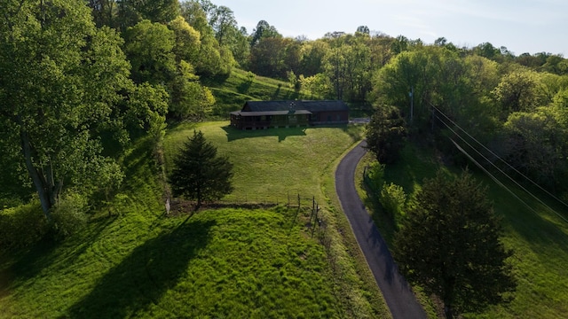 drone / aerial view featuring a view of trees