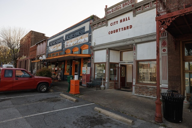 view of building exterior featuring uncovered parking