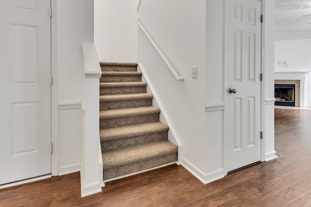 7347 Autumn Crossing Way, Brentwood, TN 37027 - stairs with wood finished floors, baseboards, and a fireplace