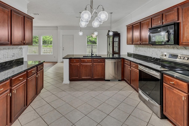 7347 Autumn Crossing Way, Brentwood, TN 37027 - kitchen with appliances with stainless steel finishes, a sink, a peninsula, backsplash, and plenty of natural light