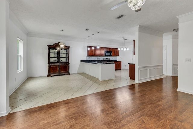 7347 Autumn Crossing Way, Brentwood, TN 37027 - kitchen with black microwave, dark countertops, a sink, ceiling fan, and a peninsula