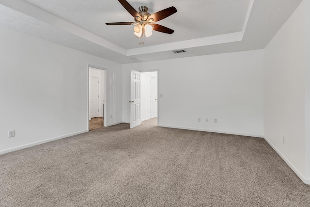 7347 Autumn Crossing Way, Brentwood, TN 37027 - unfurnished room featuring a raised ceiling, carpet flooring, ceiling fan, and baseboards