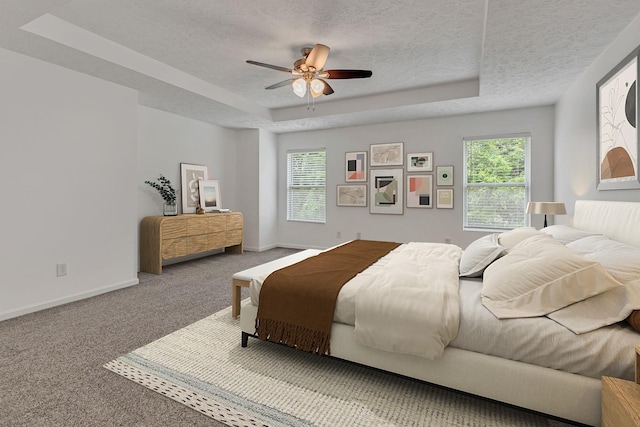 7347 Autumn Crossing Way, Brentwood, TN 37027 - carpeted bedroom with a tray ceiling, a textured ceiling, baseboards, and a ceiling fan