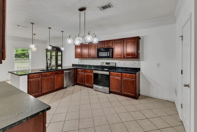7347 Autumn Crossing Way, Brentwood, TN 37027 - kitchen with stainless steel appliances, a sink, backsplash, a peninsula, and pendant lighting