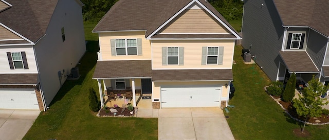 524 Burchell Ln, Columbia, TN 38401 - view of front of house with a garage, a shingled roof, concrete driveway, and cooling unit
