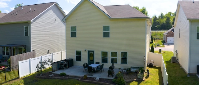 524 Burchell Ln, Columbia, TN 38401 - rear view of house with a patio, a fenced backyard, and a yard