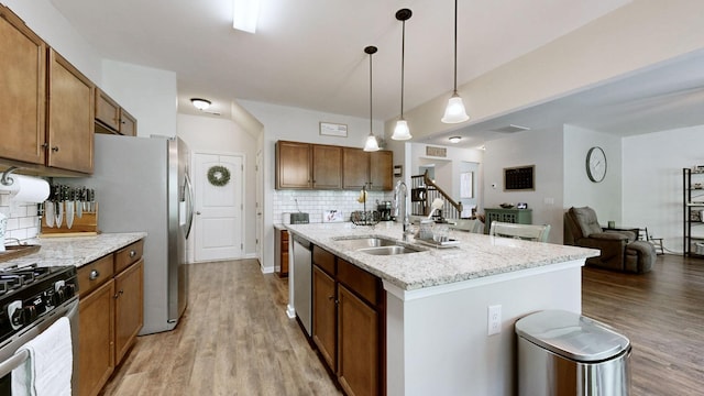 524 Burchell Ln, Columbia, TN 38401 - kitchen featuring a sink, appliances with stainless steel finishes, backsplash, and light wood finished floors