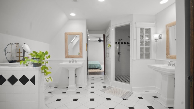 full bathroom featuring a ceiling fan, baseboards, recessed lighting, and tiled shower