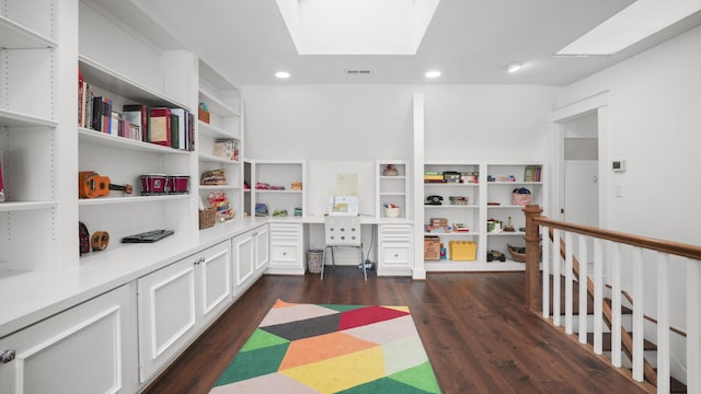 interior space with visible vents, recessed lighting, dark wood finished floors, and a skylight