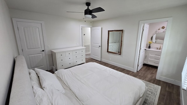bedroom with ceiling fan, visible vents, ensuite bathroom, baseboards, and dark wood-style flooring