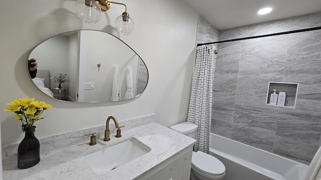 full bath featuring toilet, recessed lighting, shower / bath combo, and vanity
