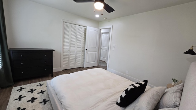 bedroom featuring a closet, ceiling fan, wood finished floors, and baseboards