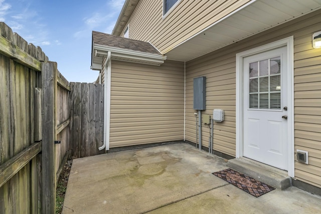 3031 Rg Buchanan Dr, La Vergne, TN 37086 - view of exterior entry with a patio, fence, and roof with shingles