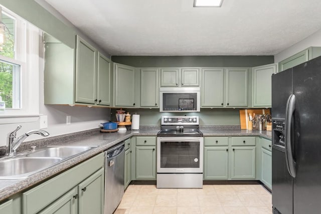 5070 Ridge Rd, Joelton, TN 37080 - kitchen featuring green cabinetry, stainless steel appliances, and a sink