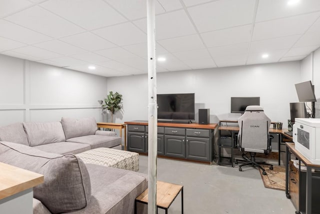 5070 Ridge Rd, Joelton, TN 37080 - living area featuring a paneled ceiling and concrete flooring