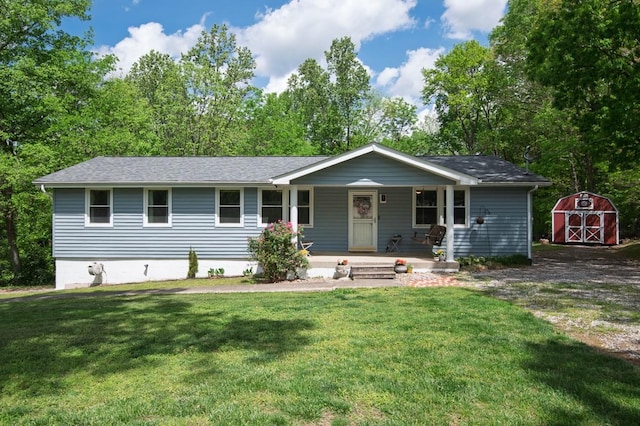 5070 Ridge Rd, Joelton, TN 37080 - ranch-style home with an outdoor structure, covered porch, a storage unit, a shingled roof, and a front yard