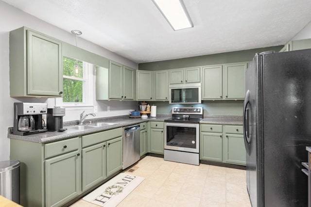 5070 Ridge Rd, Joelton, TN 37080 - kitchen featuring appliances with stainless steel finishes, green cabinets, light floors, and a sink