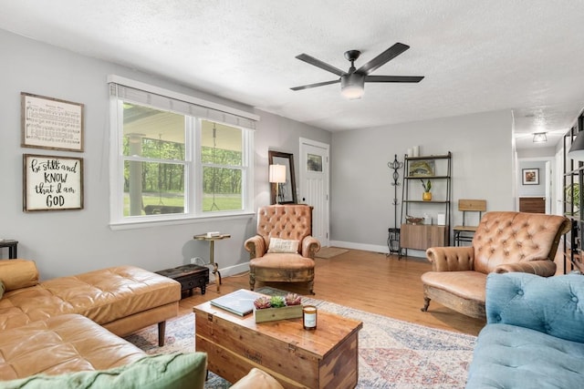 5070 Ridge Rd, Joelton, TN 37080 - living area with baseboards, wood finished floors, a ceiling fan, and a textured ceiling