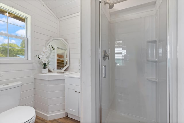 10931 Beechcraft Rd, Bon Aqua, TN 37025 - full bathroom featuring vanity, toilet, a shower stall, wood finished floors, and vaulted ceiling