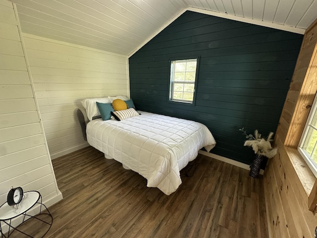 10931 Beechcraft Rd, Bon Aqua, TN 37025 - bedroom with wood walls, vaulted ceiling, multiple windows, and dark wood finished floors