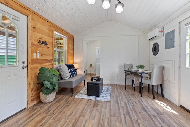 10931 Beechcraft Rd, Bon Aqua, TN 37025 - living area with wooden walls, an AC wall unit, wood finished floors, and lofted ceiling