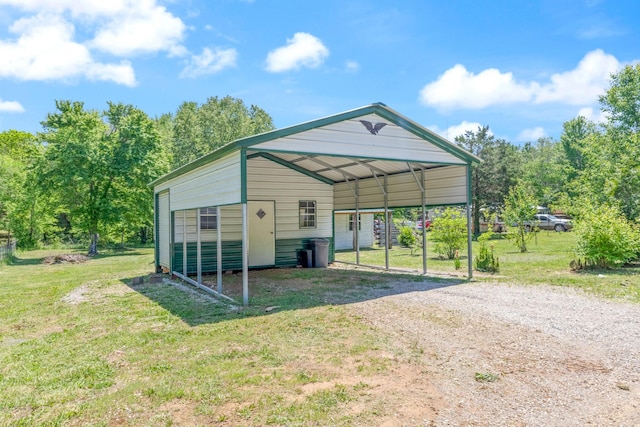 10931 Beechcraft Rd, Bon Aqua, TN 37025 - view of outdoor structure with driveway, an outdoor structure, and a carport