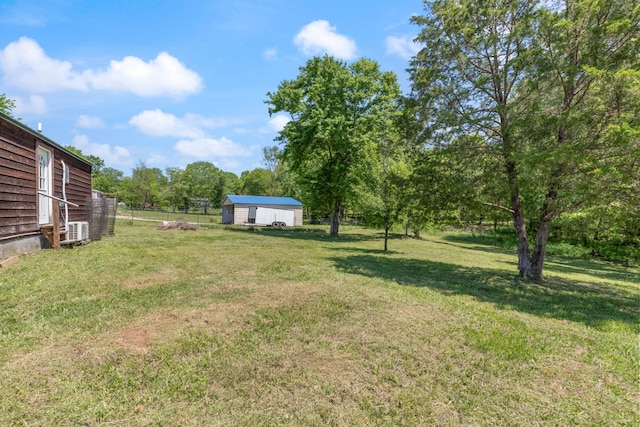 10931 Beechcraft Rd, Bon Aqua, TN 37025 - view of yard with fence and an outbuilding