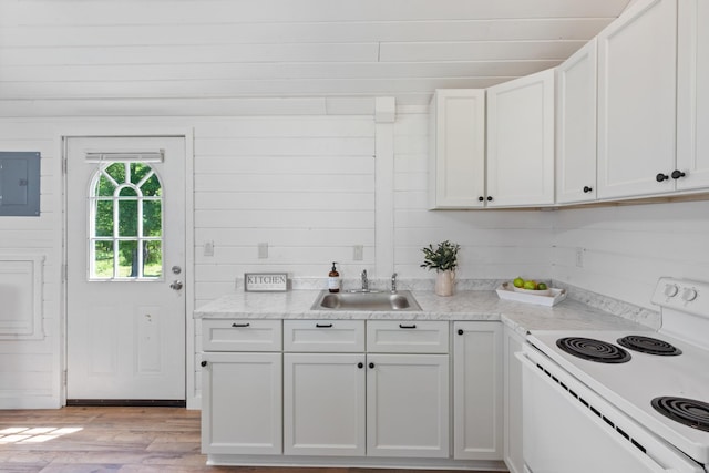 10931 Beechcraft Rd, Bon Aqua, TN 37025 - kitchen with electric panel, a sink, white cabinets, light wood-style floors, and white electric range oven