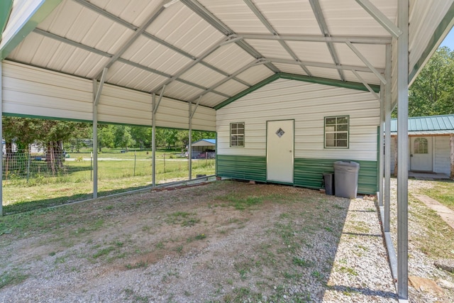 10931 Beechcraft Rd, Bon Aqua, TN 37025 - view of outbuilding featuring fence, a detached carport, and an outbuilding