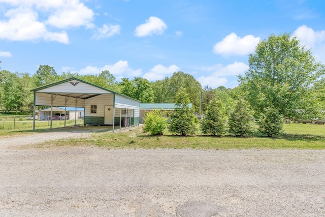10931 Beechcraft Rd, Bon Aqua, TN 37025 - exterior space with fence, a carport, and driveway
