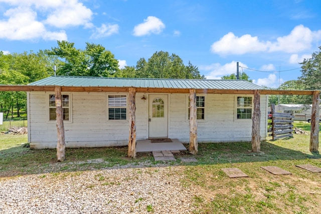 10931 Beechcraft Rd, Bon Aqua, TN 37025 - view of front of house with fence and metal roof