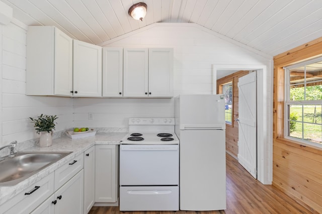 10931 Beechcraft Rd, Bon Aqua, TN 37025 - kitchen with a sink, white appliances, wood walls, wood finished floors, and vaulted ceiling