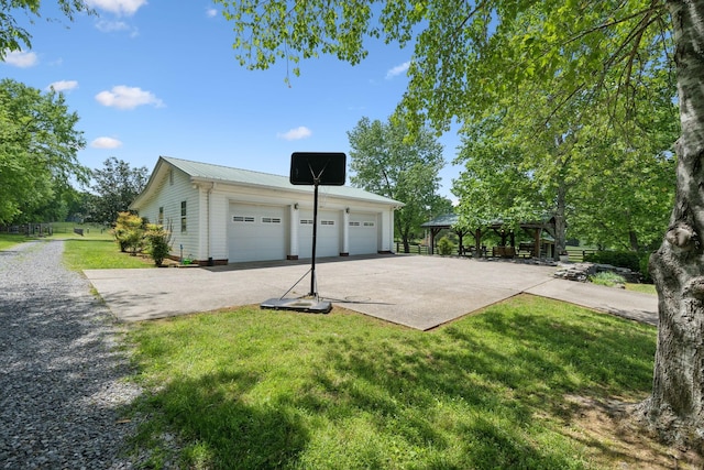 1494 Grant Rd, Watertown, TN 37184 - view of property exterior featuring metal roof, a garage, a gazebo, an outdoor structure, and a yard