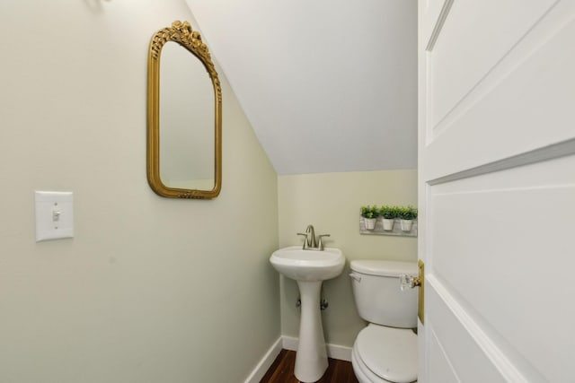 1494 Grant Rd, Watertown, TN 37184 - half bath with toilet, baseboards, vaulted ceiling, and wood finished floors