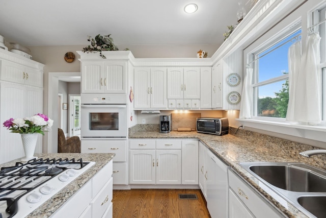 1494 Grant Rd, Watertown, TN 37184 - kitchen with a sink, white cabinetry, and white appliances