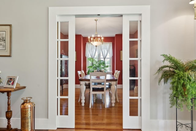 1494 Grant Rd, Watertown, TN 37184 - dining area with french doors, wood finished floors, and an inviting chandelier