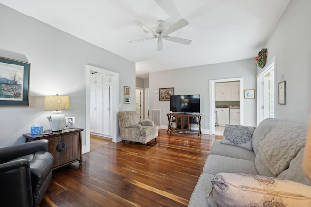 1494 Grant Rd, Watertown, TN 37184 - living area featuring visible vents, baseboards, hardwood / wood-style flooring, washing machine and clothes dryer, and a ceiling fan