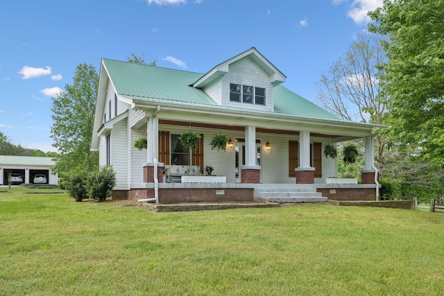 1494 Grant Rd, Watertown, TN 37184 - view of front of home with covered porch, a front yard, and metal roof