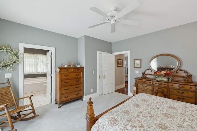 1494 Grant Rd, Watertown, TN 37184 - bedroom with baseboards, ceiling fan, light carpet, and ensuite bath