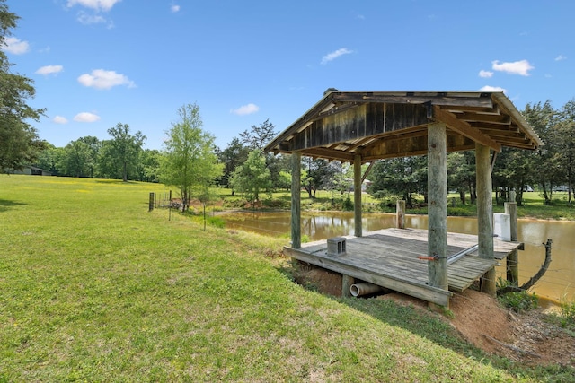1494 Grant Rd, Watertown, TN 37184 - surrounding community with a lawn and a water view